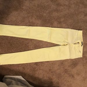 Bright pastel yellow skinny jeans